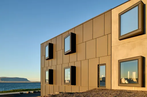The neutral-toned modern exterior of the Black Sand Hotel located on the Ölfus peninsula along Iceland’s south coast.