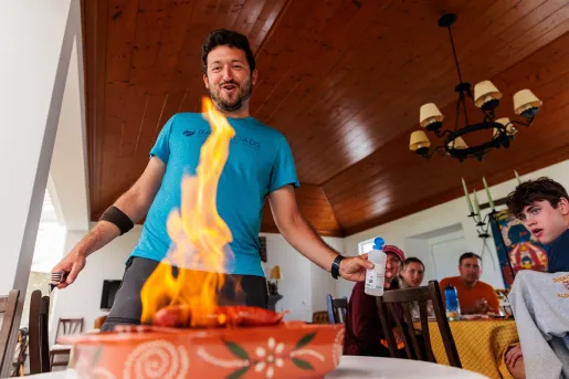 Man lighting a plate of food on fire