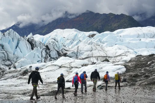 A group of guests ice walk the starkly beautiful landscape of Matanuska Glacier.’