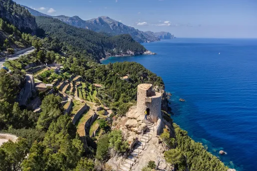 Sky view of ocean coast with ruins of stone buildings
