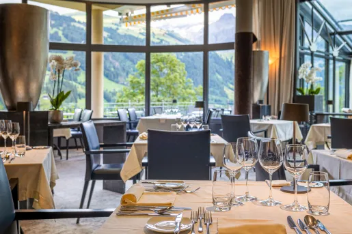 Restaurant with white tables and navy blue chairs