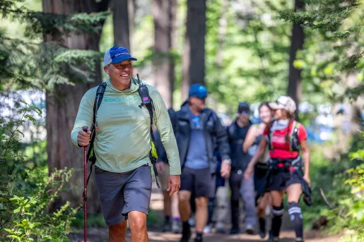 Hikers walk along Yosemite Valley Loop trail.