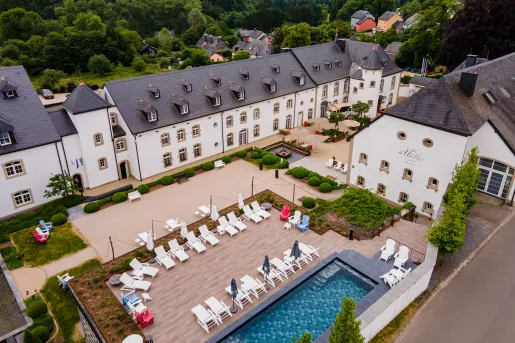 Sky view of a hotel complex and an outdoor pool