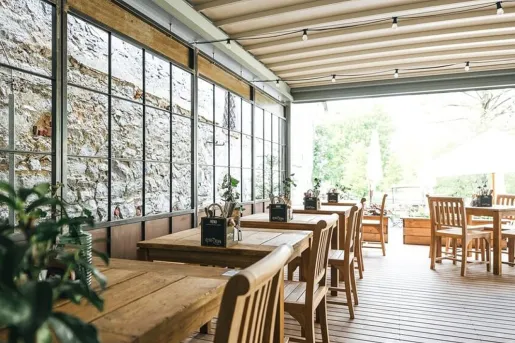 Rustic dining room at Boutique Hotel Latrán in Český Krumlov, Czech Republic.