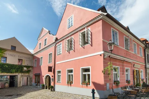 The pink exterior of Boutique Hotel Latrán in Český Krumlov, Czech Republic.
