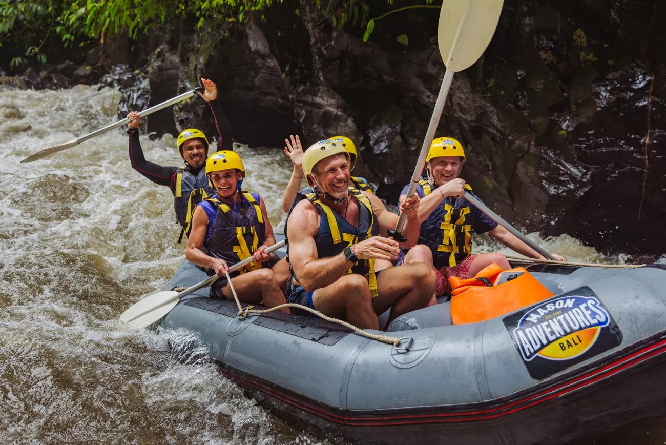 Group of people on a raft in an active river