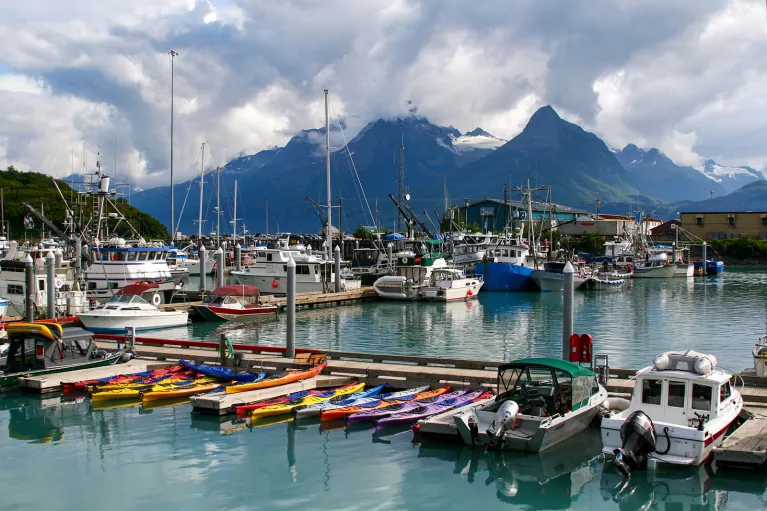 Boats sitting in a harbor atin Alaska