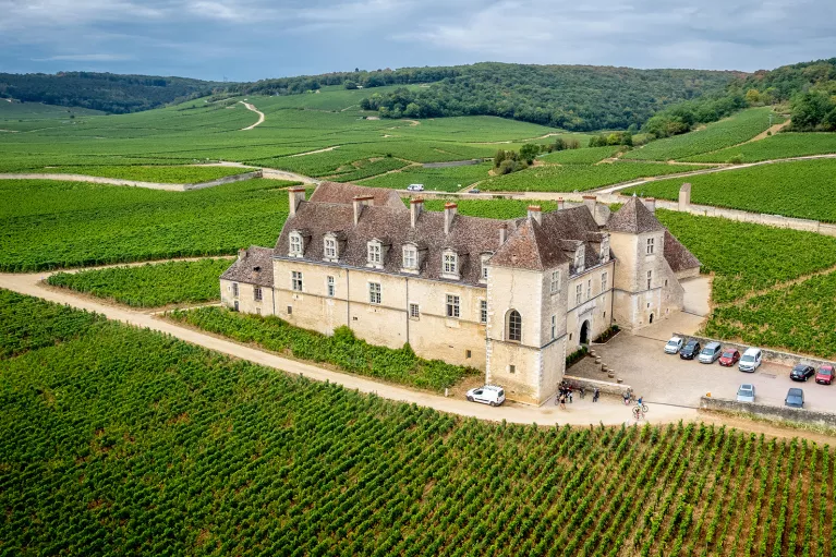 Building Surrounded by Fields and Hills