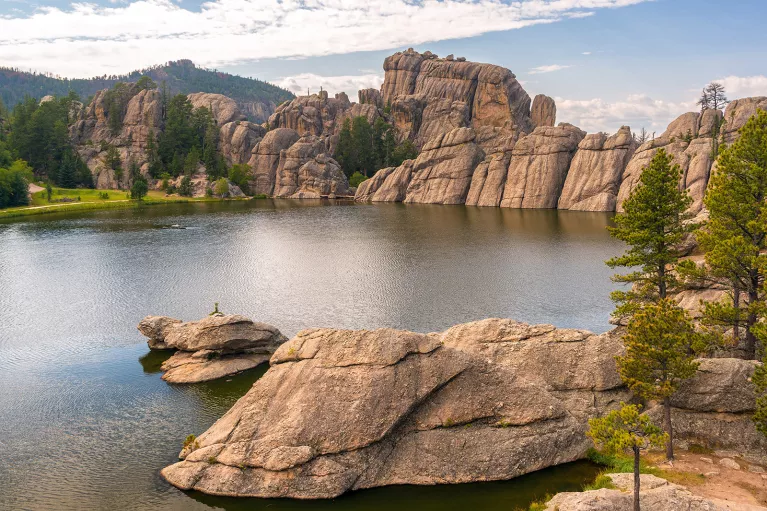 Rock formation and lagoon with trees