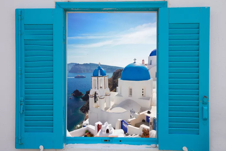 Light blue windowsill, overlooking blue and white Mediterranean domed houses.