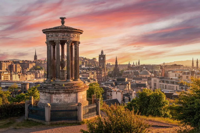 Monument overlooking the city during sunset