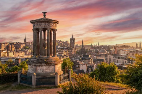 Monument overlooking the city during sunset