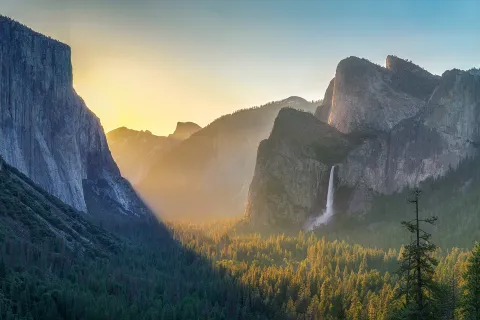 Wide shot of mountains at sunset.