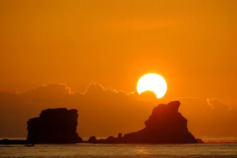 Sun rising over the water