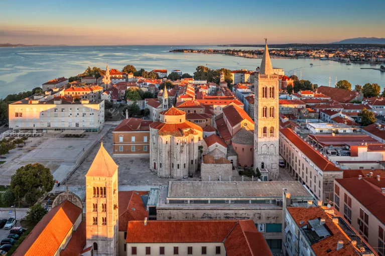 Sky view of town with the ocean in the background