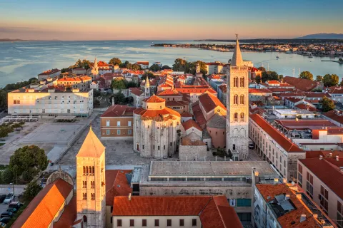 Sky view of town with the ocean in the background