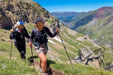 Two backroads guests hike through the mountains