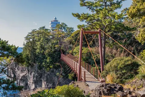 Kadowaki lighthouse and the suspension bridge on the Izu Peninsula.