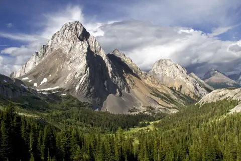 Large mountains with a valley of trees on the ground floor