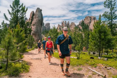 Guests being led by a Backroad's trip leader on a trail through South Dakota