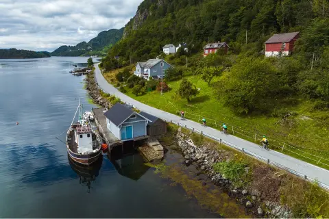 Lake shore with a boat docked by a hut