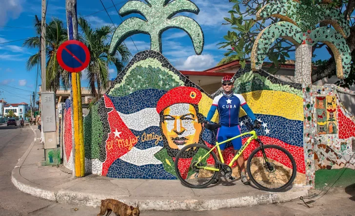 Cyclist in Front of Art Work Cuba