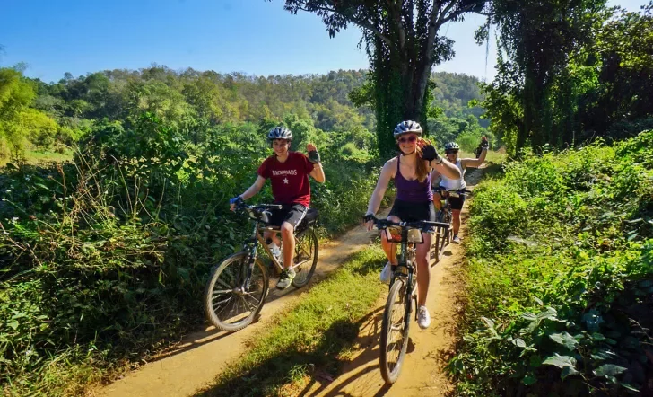 Backroads guests riding through a jungle in Thailand