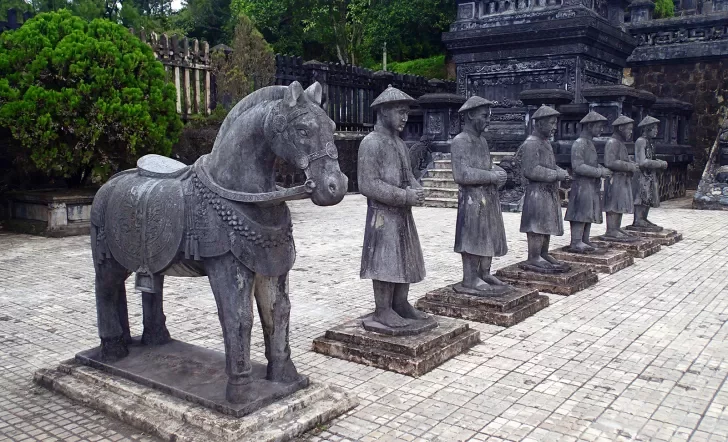 Row of stone statues at a temple in Asia