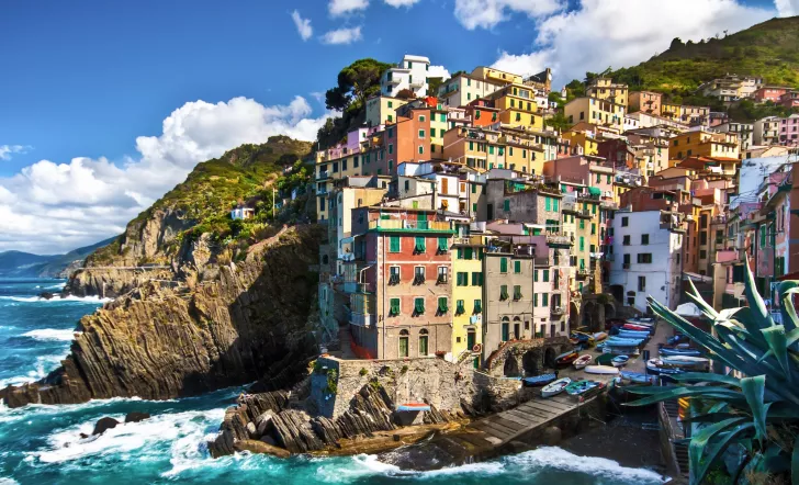 Cliffside by the ocean with buildings on top