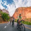 Below eye-level shot of three bikers in canyon