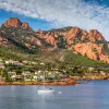 Village And Trees Among Red Rocks of Esterel Massif During Sunny Day-French Riviera, Provence-Alpes, Cote d'Azur, France