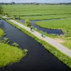 Ariel view of bikers in fields with ponds