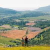 Two hikers overlooking a valley in Quebec, Canada