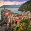 Wide shot of Cinque Terre coastal village.