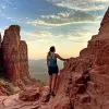 Guest on red-rock clifftop, overlooking Utah valley.