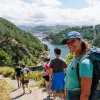 Group of people hiking with a woman turning around and smiling