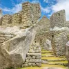 Stone ruins of an ancient town, with stone steps covered with grass