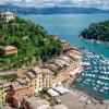 Sky view of a row of buildings in front of a boat dock