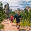 Guests being led by a Backroad's trip leader on a trail through South Dakota