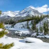 Large snow-capped mountains and trees