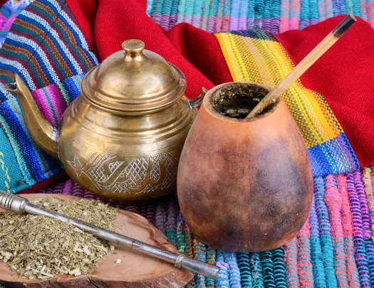 Close-up of dry yerba mate infusion pot and gourd.