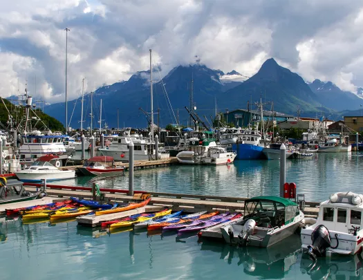 Boats sitting in a harbor atin Alaska