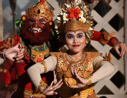 Shot of locals in ceremonial garb, masks, jewelry, etc.