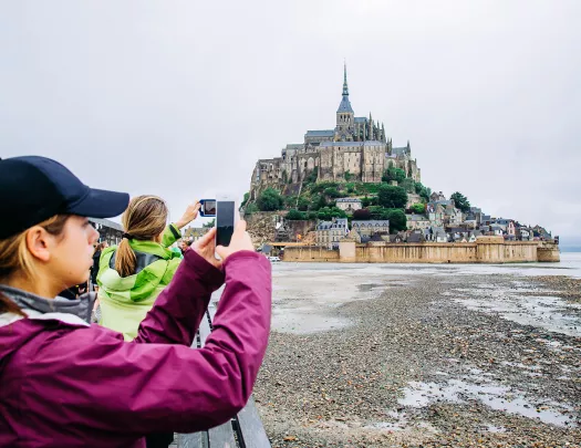 Backroads Guests Taking Photos of Le Mont Saint-Michel Tidal Island 
