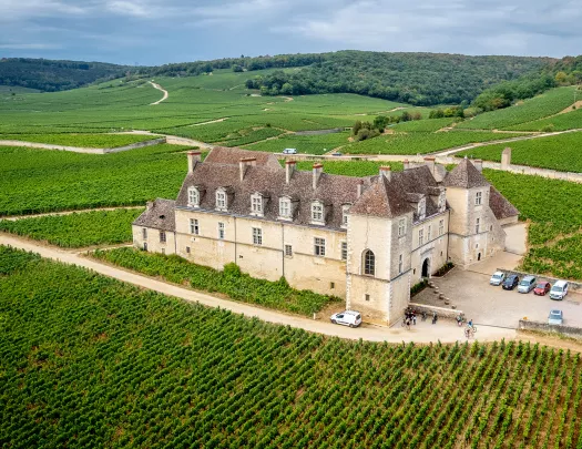 Building Surrounded by Fields and Hills