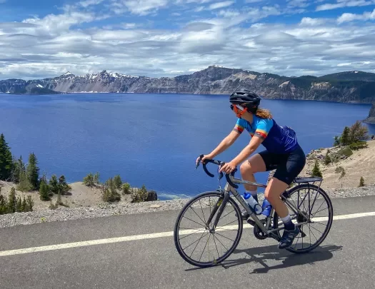 Guest cycling past Crater Lake.
