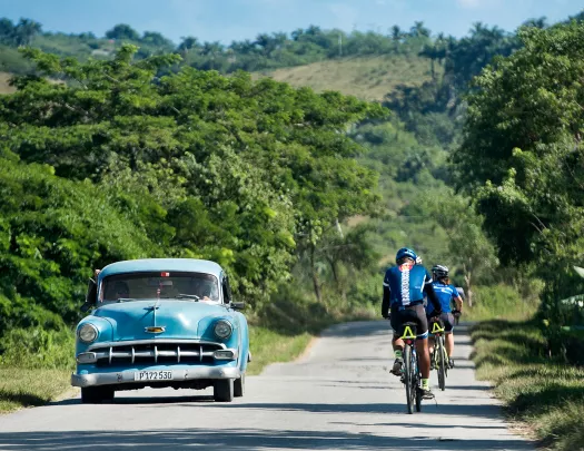 Cycling Past Classic Car