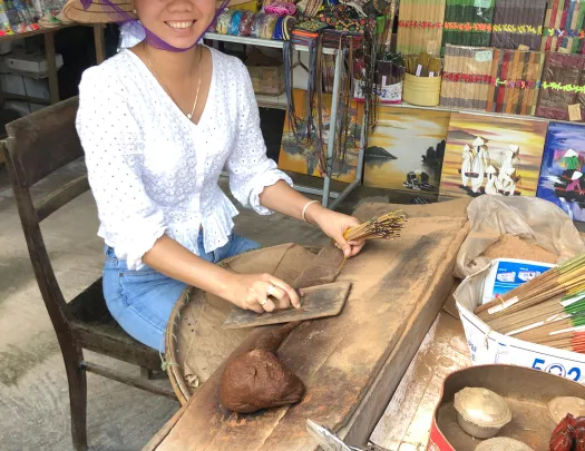 Local Vietnamese woman preparing food