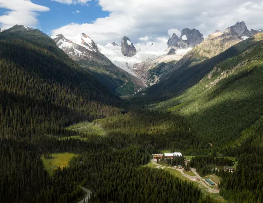 Bird's eye shot of Bugaboos, small valley housing below.
