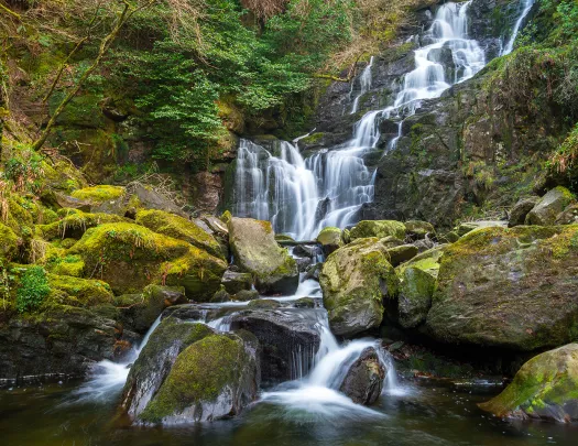 waterfall over mossy rocks